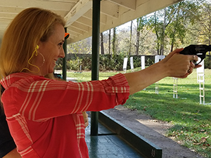 HQL classes are fun and will teach you the skills you need to safely handle a handgun.  This is a student at our outdoor range.